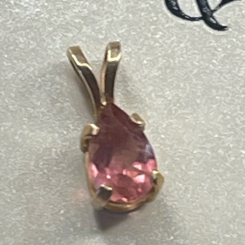 14k gold pendant don’t know what kind of stone made of small tiny pendants
